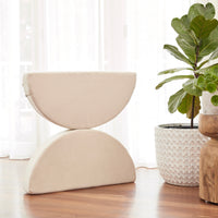 two large semi circle shapes balancing on each other of the membina play couch
