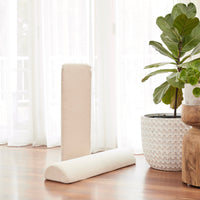 a pair of semi circle bolsters that act like armrests on the membina play couch